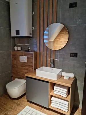 a bathroom with a sink and a mirror at Garnet Star Apartments, Kopaonik, apartman broj 4 in Kopaonik