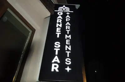 a sign on the side of a building at Garnet Star Apartments, Kopaonik, apartman broj 4 in Kopaonik