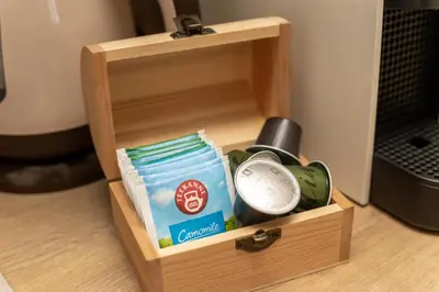a wooden box with a bottle and aperature at Apartman Stankovic Milmari Resort in Kopaonik