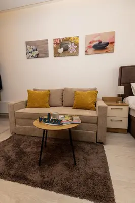 a living room with a couch and a table at Apartman Stankovic Milmari Resort in Kopaonik