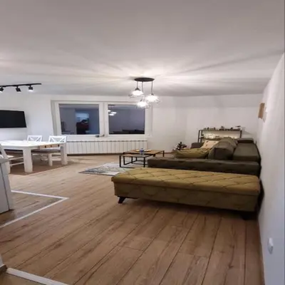 a large living room with a bed and a couch at Iznad oblaka B09 in Kopaonik
