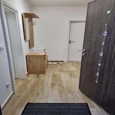 a room with a door and a wooden floor at Iznad oblaka B09 in Kopaonik
