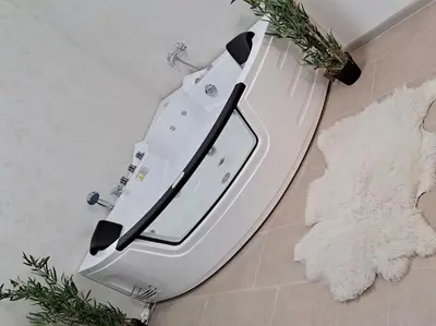 a white toilet sitting in a bathroom next to a rug at Mi Casa in Brestovac