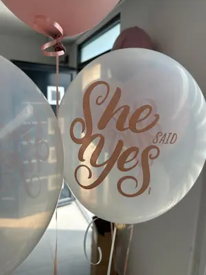 two white balloons with the end use written on them at Mi Casa in Brestovac