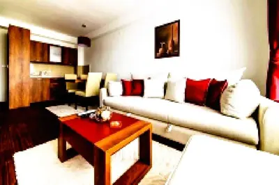 a living room with a couch and a coffee table at Apartmani BOŠ in Cajetina