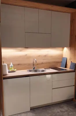 a kitchen with white cabinets and a sink at Nela apartmani (u hotelu Djina) in Kopaonik