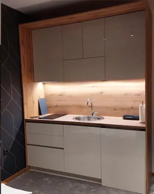 a kitchen with a sink and a mirror at Nela apartmani (u hotelu Djina) in Kopaonik