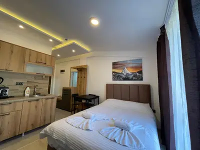 a bedroom with a bed with two pillows on it at Apartman Mile High -N Lux 90a Milmari Kopaonik in Kopaonik