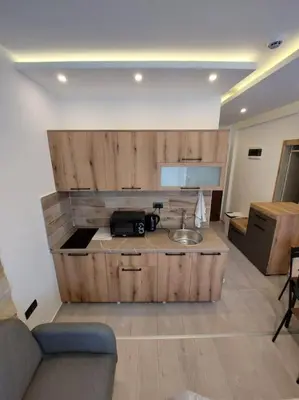 a kitchen with a sink and a counter with a sink at Apartman Mile High -N Lux 90a Milmari Kopaonik in Kopaonik