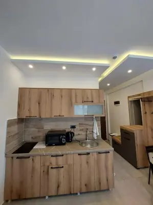 a kitchen with a sink and a counter top at Apartman Mile High -N Lux 90a Milmari Kopaonik in Kopaonik