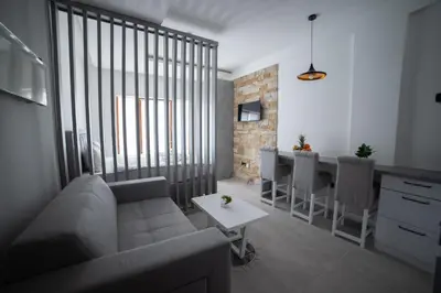 a living room with a couch and a table at NLux 11 Apartment in Kopaonik