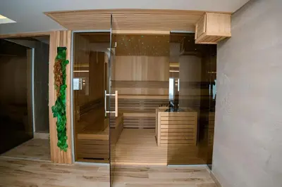 a bathroom with a shower and a sink in a room at NLux 11 Apartment in Kopaonik