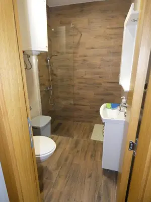 a bathroom with a toilet and a sink at Apartman Katarina in Soko Banja