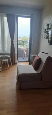 a bedroom with a bed and a large window at Apartman Katarina in Soko Banja
