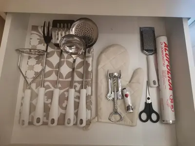 a drawer filled with kitchen utensils on a counter at BELVEDERE A9 ( N LUX MILMARI RESORT) in Kopaonik