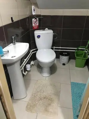 a bathroom with a toilet and a sink at APARTMAN Pahuljica in Kruševac