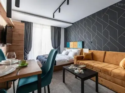 a living room with a couch and a bed at Lux studio Andrej A43 Hotel Djina in Kopaonik