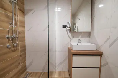 a bathroom with a sink and a shower at Lux studio Andrej A43 Hotel Djina in Kopaonik