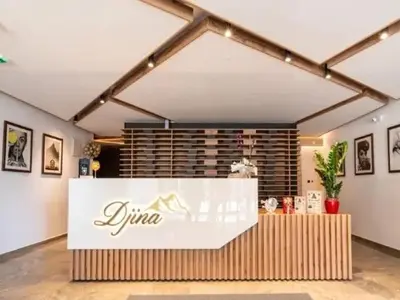 a restaurant with a sign on a counter in a room at Lux studio Andrej A43 Hotel Djina in Kopaonik