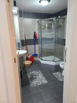 a bathroom with a shower and a toilet and a sink at Apartman B 8 - Lapčević u zgradi MUJEN LUX, Kopaonik in Kopaonik
