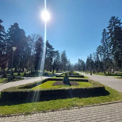 a park with a light pole in the middle at Apartman Krinka in Vrnjačka Banja