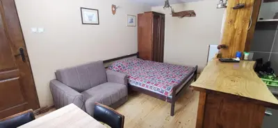 a living room with a couch and a table at Konak Šarac in Crni Vrh
