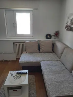 a living room with a couch and a table at MR. O Apartments Kopaonik in Kopaonik