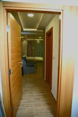 a hallway with a door leading to a room at Apartman A20B in Kopaonik
