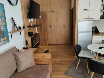 a living room with a couch and a table at Start Apartments LUX KOPAONIK in Kopaonik