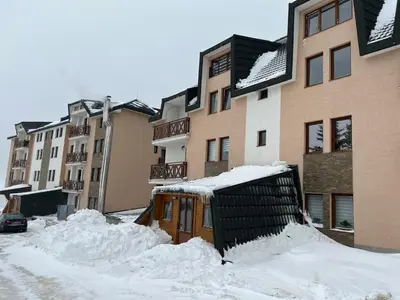 a pile of snow in front of some buildings at Sunčani Breg Resort&Spa Kopaonik, Apartman broj 409 in Kopaonik