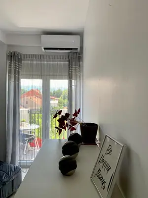 a room with a table with some rocks on it at Apartman-Stefanovic in Vranje