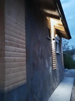 a building with the sun shining on the side of it at Stari Hrast 1 in Prolomska Banja