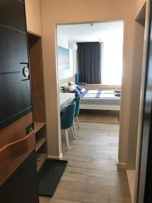a view of a room with a bed and a bedroom at Apartman Relax in Niš