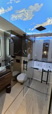 a bathroom with a tub and a toilet and a sink at Design Apartment PLATINIUM SPA LUX 5 STAR 