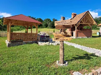 a wooden sign in front of a gazebo at MERAK STD in Vranje