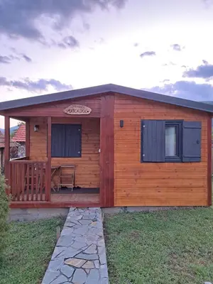 a log cabin with a porch and a deck at MERAK STD in Vranje