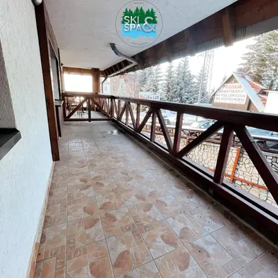 a corridor of a building with a balcony at SKI & SPA Apartment in ZONED in Kopaonik
