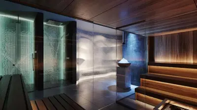 a bathroom with a shower with a glass wall at Woodside Kopaonik AAC in Raška