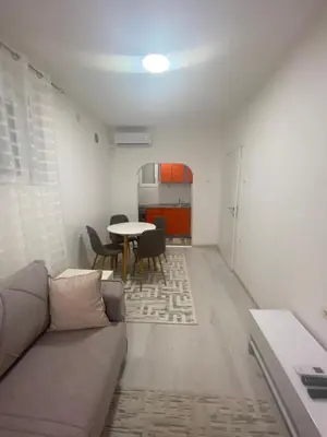 a living room with a couch and a table at Eleni in Vrnjačka Banja