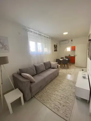 a living room with a couch and a table at Eleni in Vrnjačka Banja