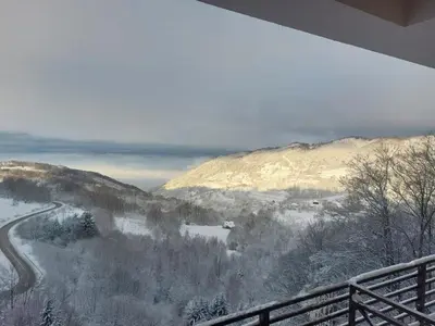 a view of a snow covered mountain with a road at Milmari Golden N LUX 62 in Kopaonik