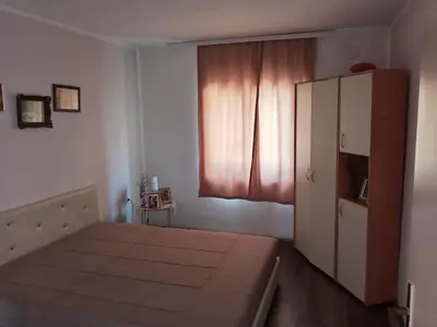 a bedroom with a bed and a cabinet and a window at Oko Jastrepca in Veliko Krušince