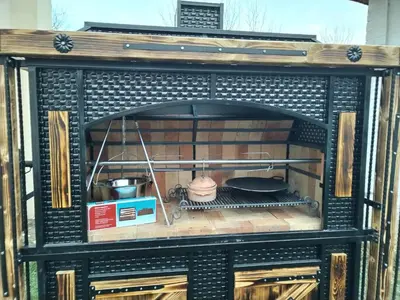a brick oven with a food inside of it at Oko Jastrepca in Veliko Krušince
