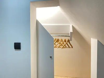 a room with a white door with a rack of wine bottles at Apartmani ANA - Kopaonik, Treska in Kopaonik