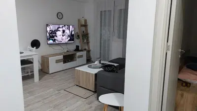 a living room with a couch and a flat screen tv at Bili in Paraćin