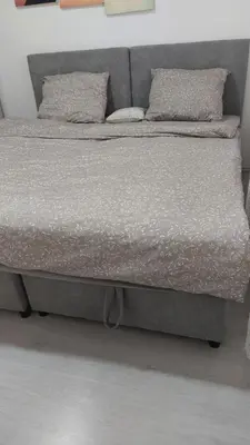 a bed with two pillows on top of it at Bili in Paraćin