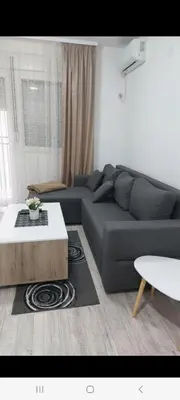 a living room with a couch and a coffee table at Bili in Paraćin