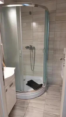 a bathroom with a shower with a glass door at Bili in Paraćin