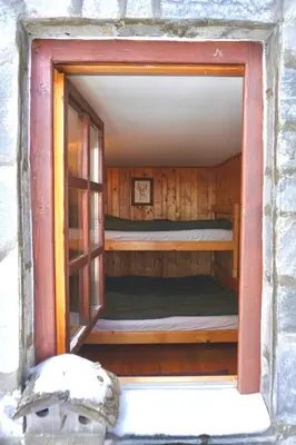a small room with a bunk bed in it at Montana Apartment in Kopaonik