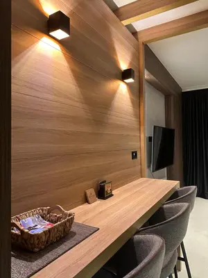 a conference room with a wooden table and chairs at Woodside Kopaonik 212 in Kopaonik
